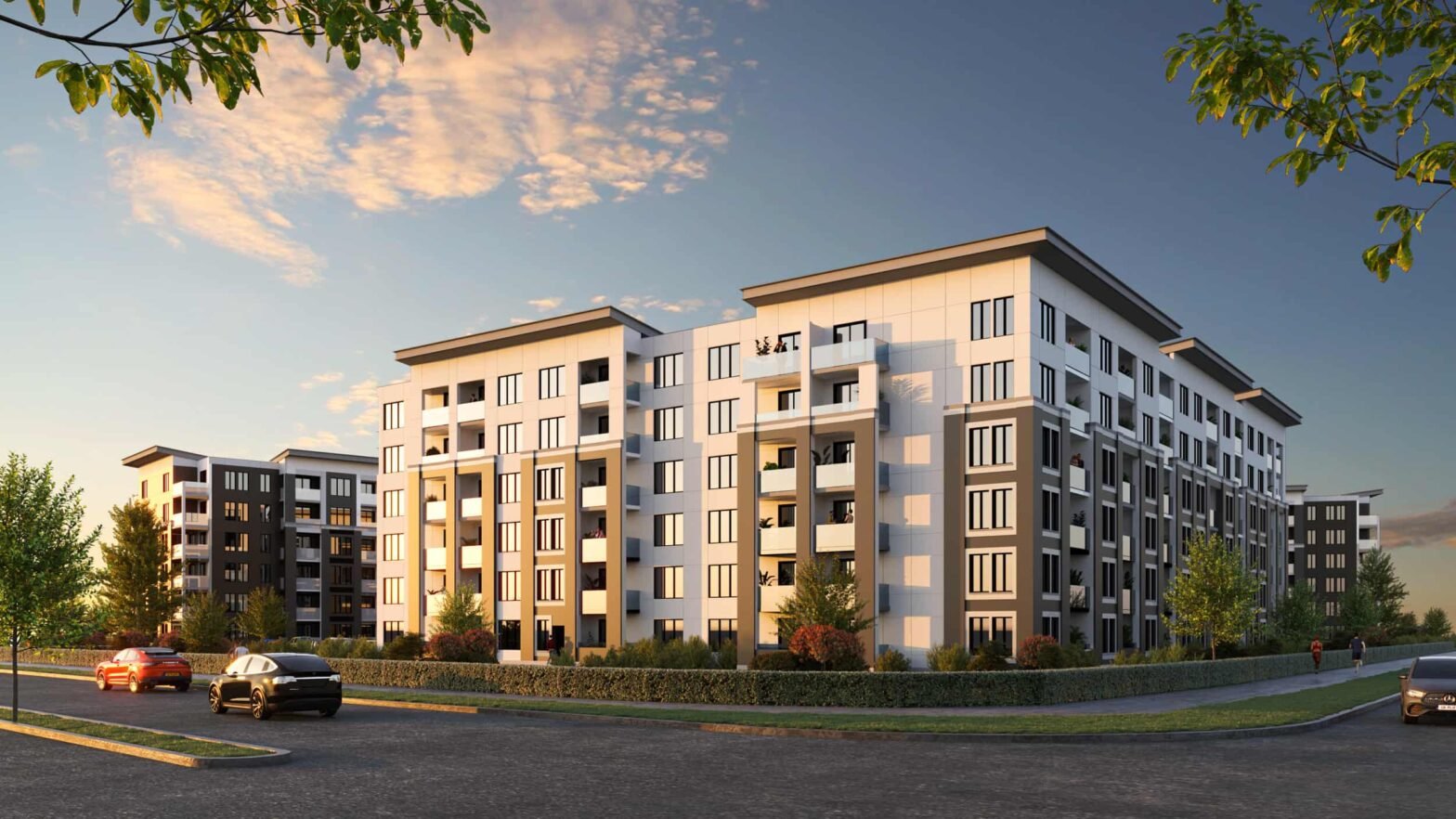 The exterior view of Creekside Condos,2026. This condo development will include plenty of parking in the midst of a lush green vista